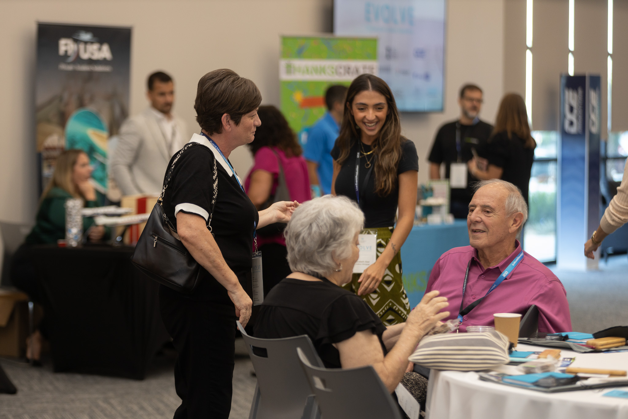 Attendees networking at EVOLVE